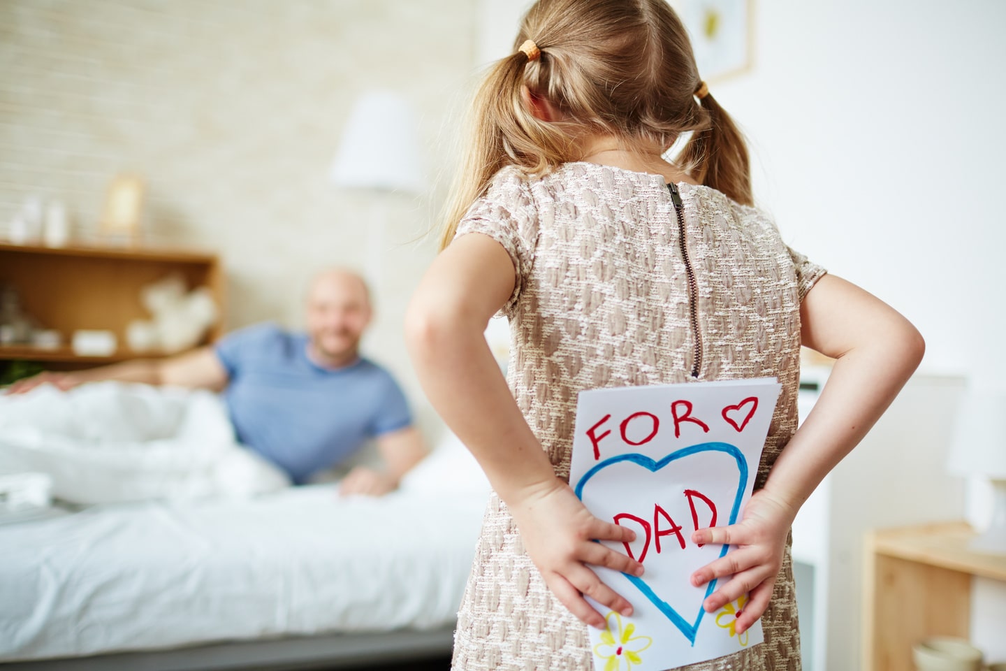 Daughter congratulating her dad with fathers day