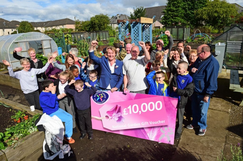 Shettleston Community Growing Project in Glasgow, TV Gardener David Domoney announces that the project are the winners of Cultivation Street and win £10,000. Pictured here with a shocked Kenny Mc Cubbin from the allotment and gardens team. Picture by Paul Chappells 11/09/17