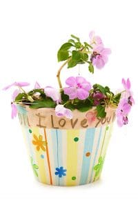Child's hand made mother's day gift painted flower pot and flower.  I Love You painted on pot.