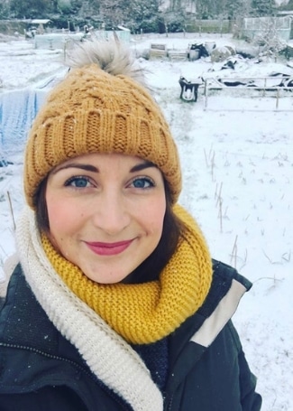 Kirsty Ward from My Little Allotment wearing bobble hat and scarf in the snow