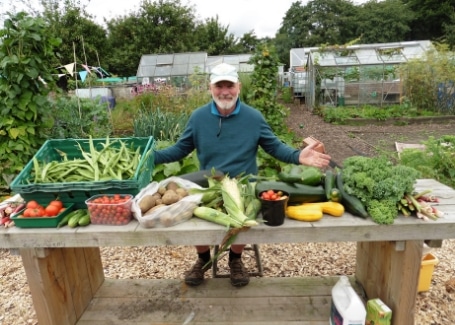 Root 'n' Fruit Community Allotment Bob Bennett displaying their vegetable harvest