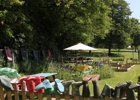 Midfield Primary School garden with wellies stored on the fence