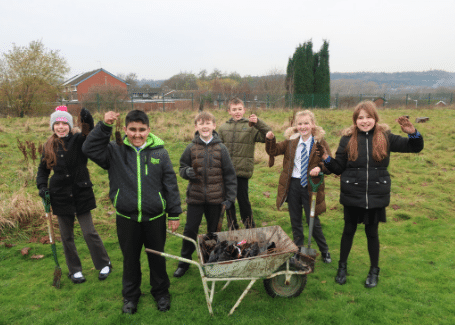 kids at Saint Nathaniels enjoying school garden