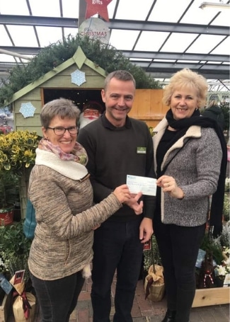Notcutts Rivendell, David presenting a cheque to the Wonky Garden for £300 from the sales of carrier bags