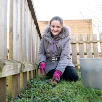 Child planting bulbs at a local hospital, arranged by Cultivation Street Dobbies ambassador Georgina Isherwood