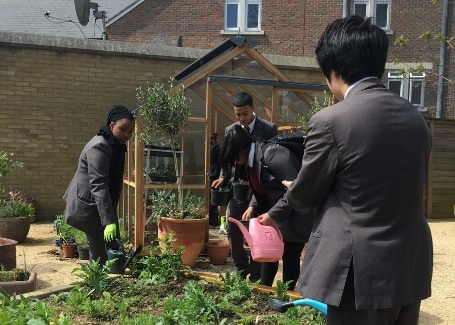 Hammersmith Academy students watering their Cultivation Street garden