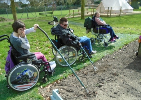 The Clare School's students working in their Cultivation Street garden without boundaries, accessible to all