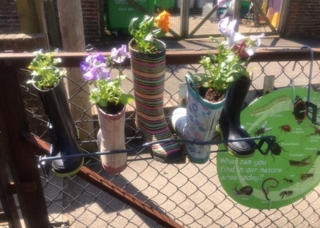 Wellie planting in a garden helped by Carol Watson, Cultivation Street ambassador for Notcutts Tunbridge Wells