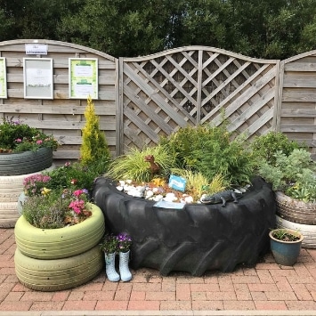 Wellie and tyre planters in Little Seedlings Community Garden, shortlisted in Cultivation Street's competition