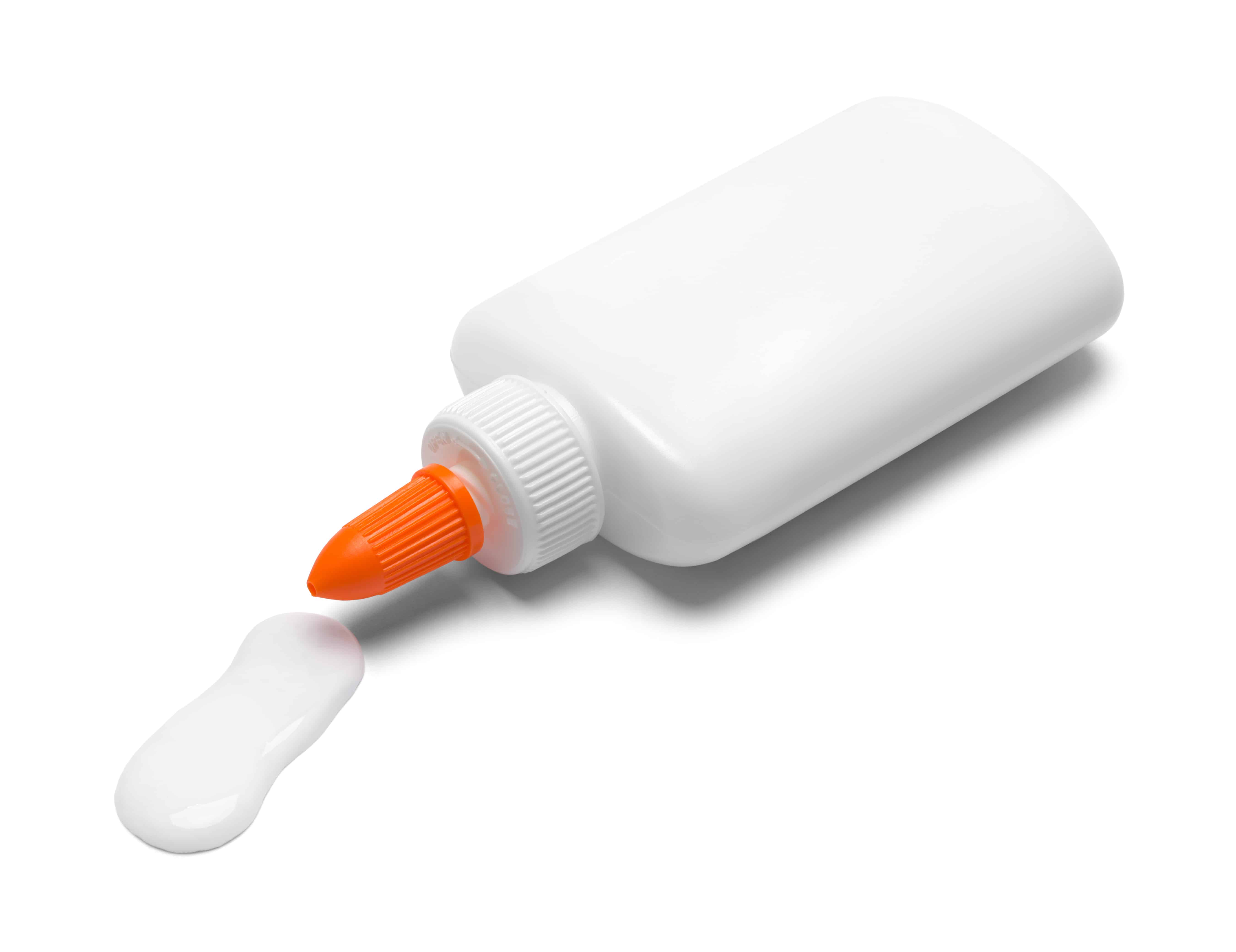 Bottle of Glue Spilling Isolated on White Background.