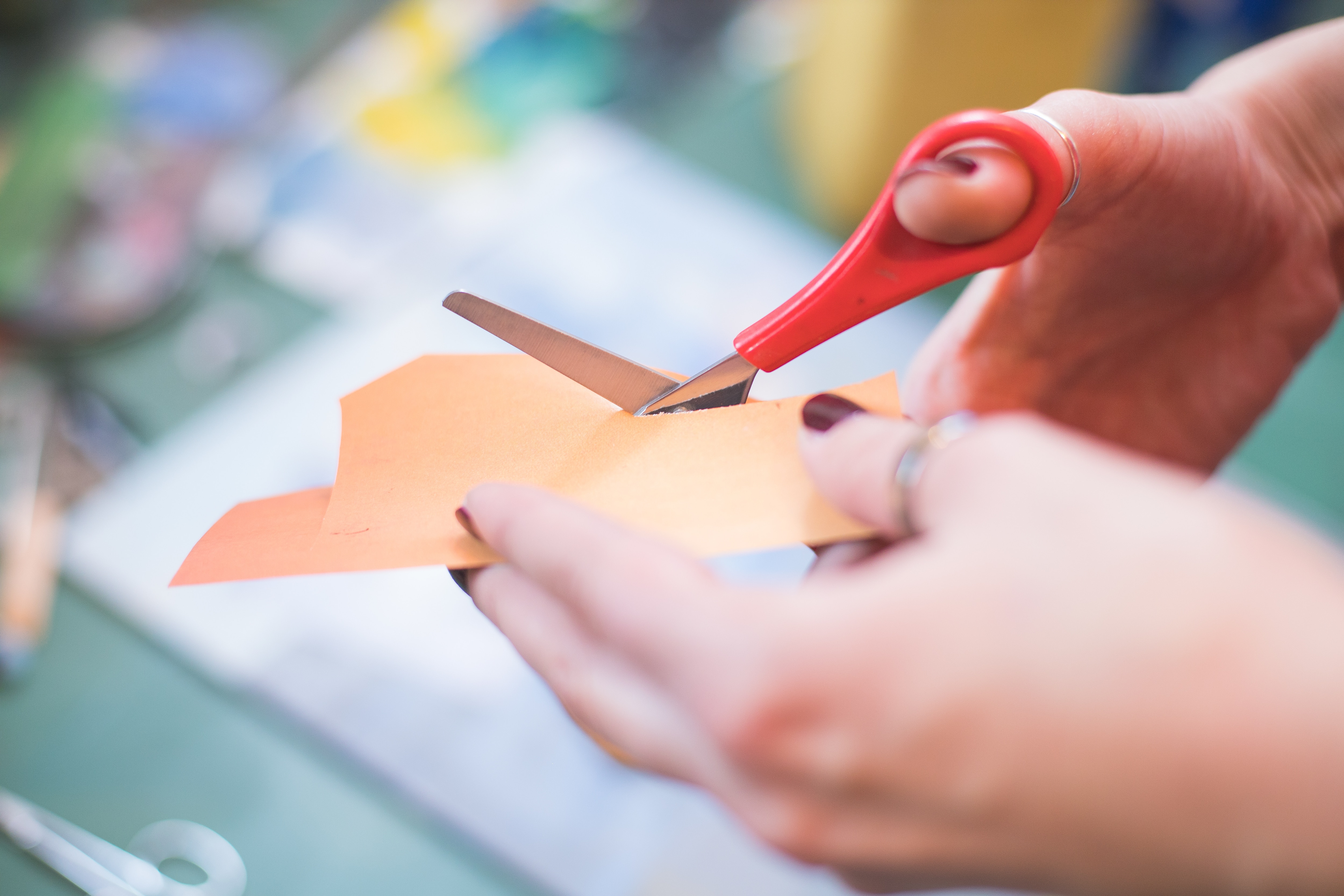 cutting paper with scissors for collage art