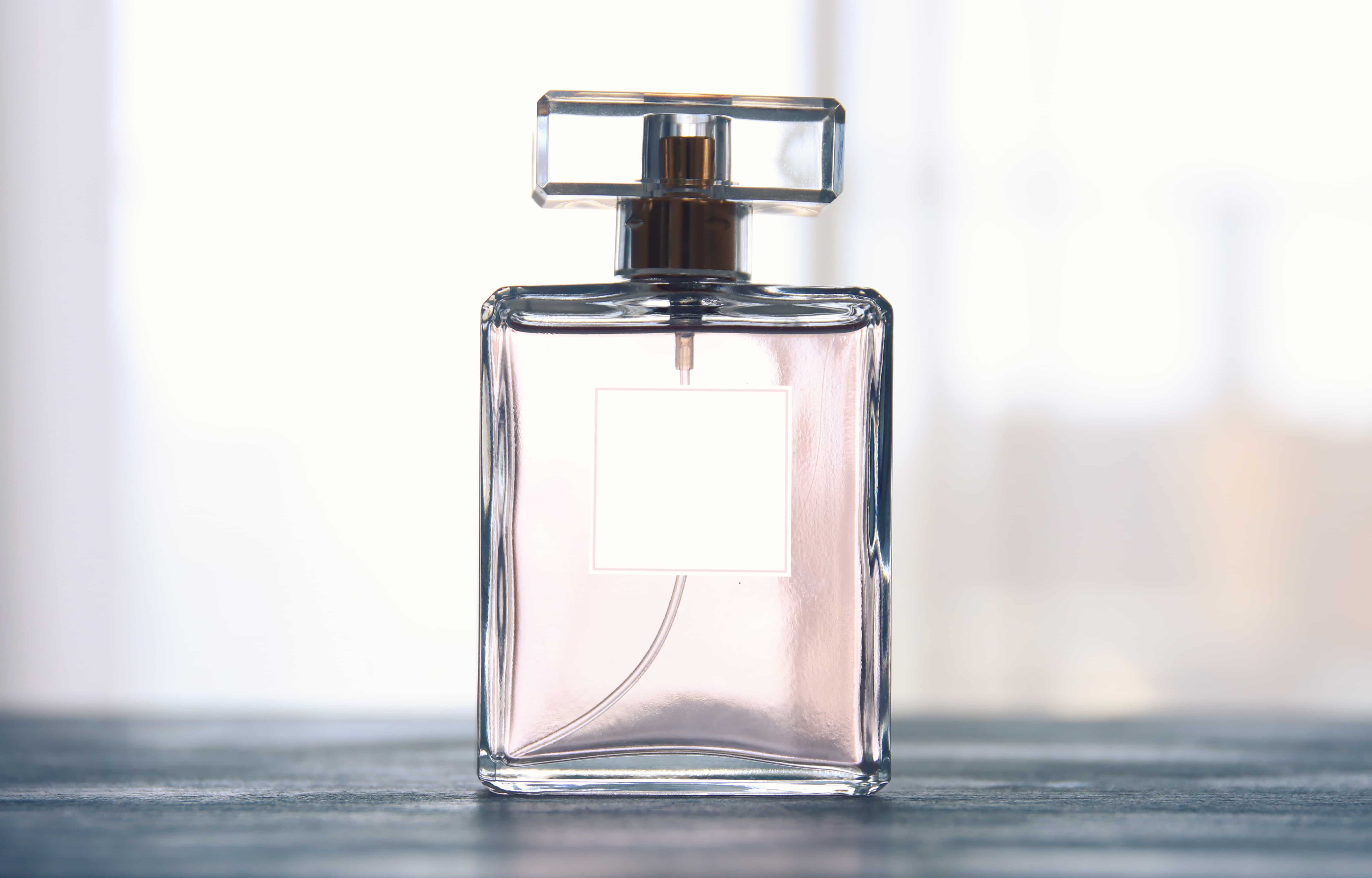 Image of elegant perfume bottle. back light photo.