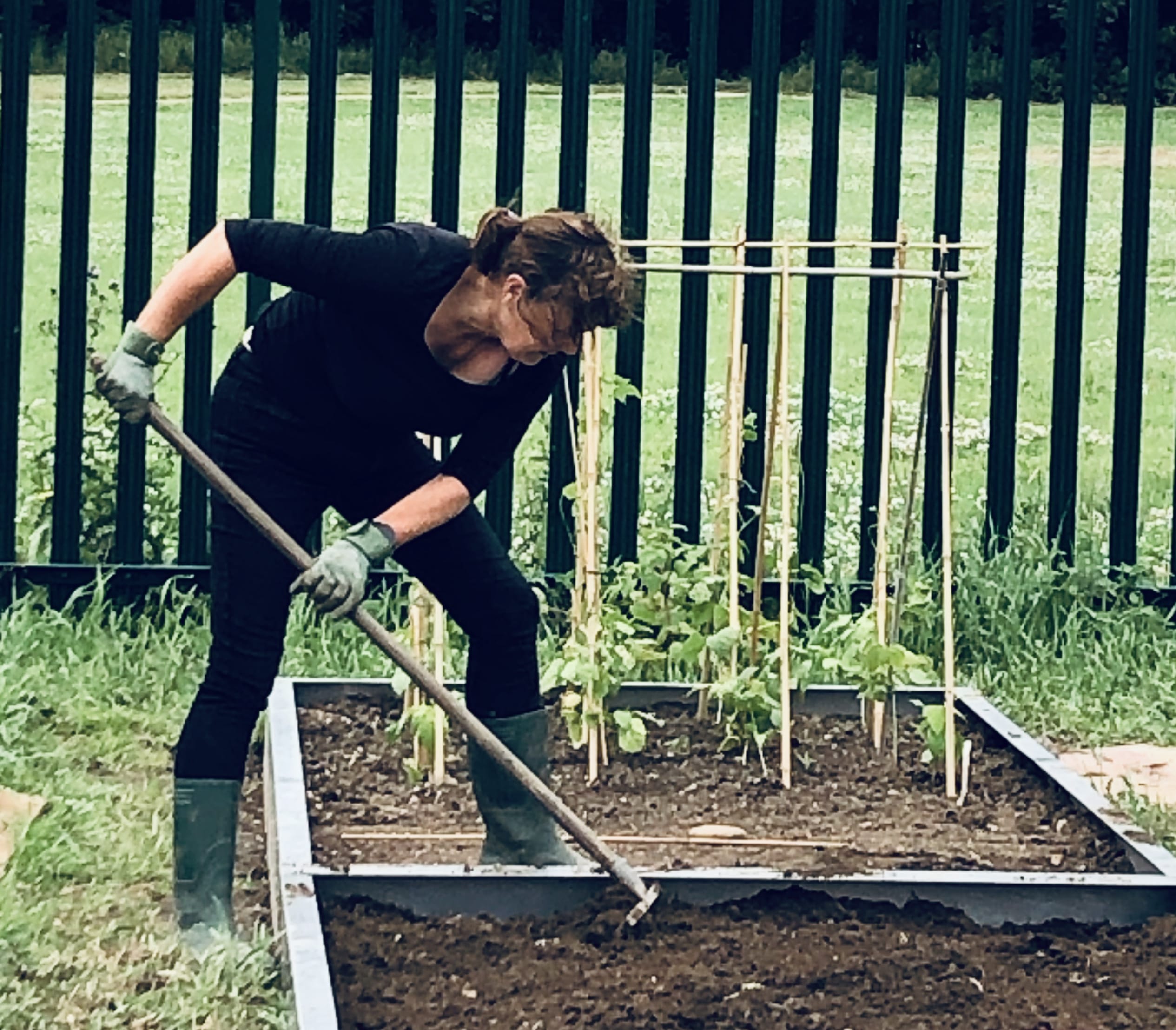 Angela-raking-in-Kitchen-Garden