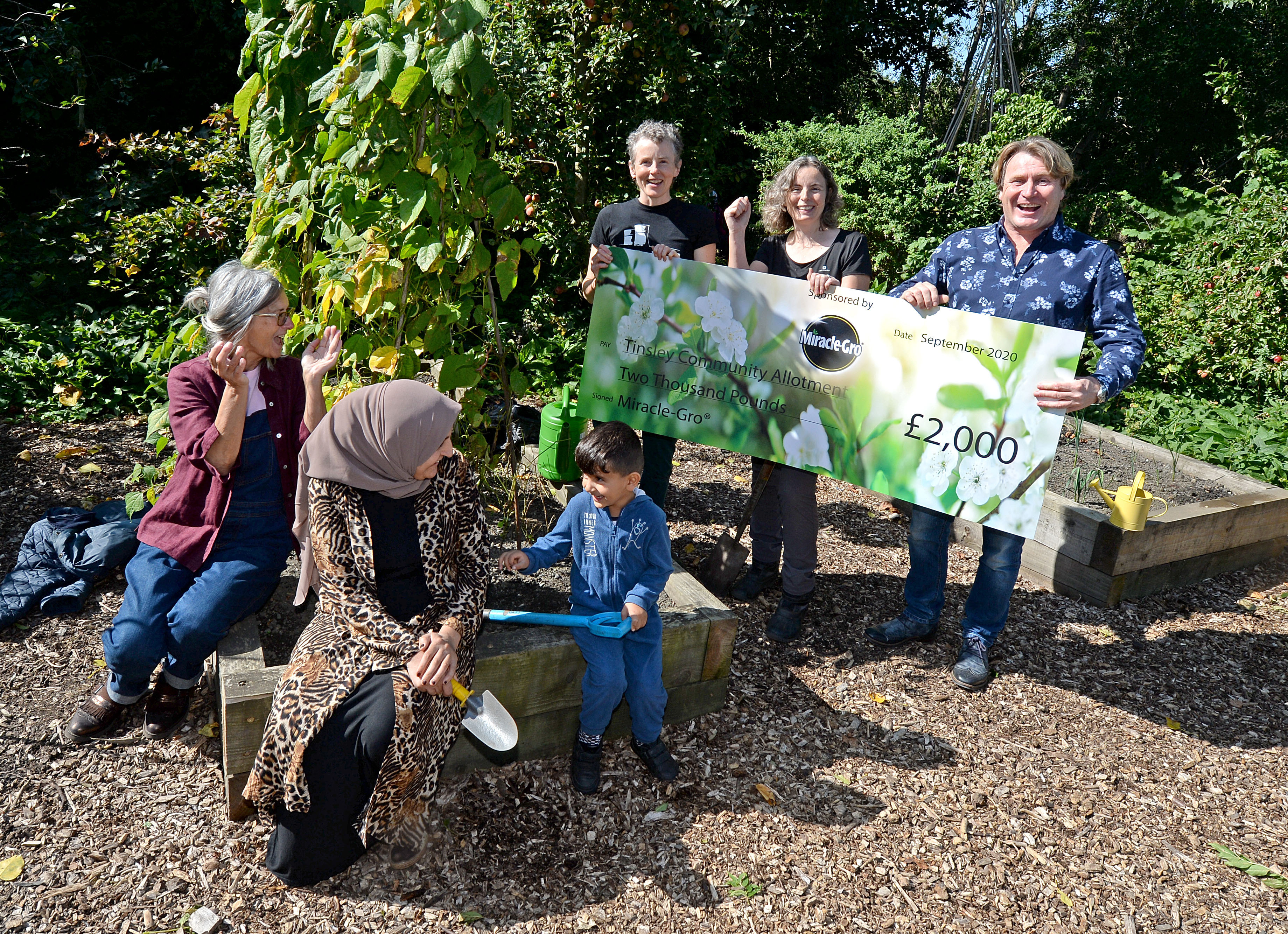 Gardener David Domoney with (L to R): Sheila Sutherland, Rezan Mohamed, Ravyer Osman, Jess Banham and Jacqui Dace at the Tinsley Community Allotment in Sheffield, South Yorkshire, which has won a 'Cultivation Street' award - a competition run by celebrity gardener, David Domoney.
