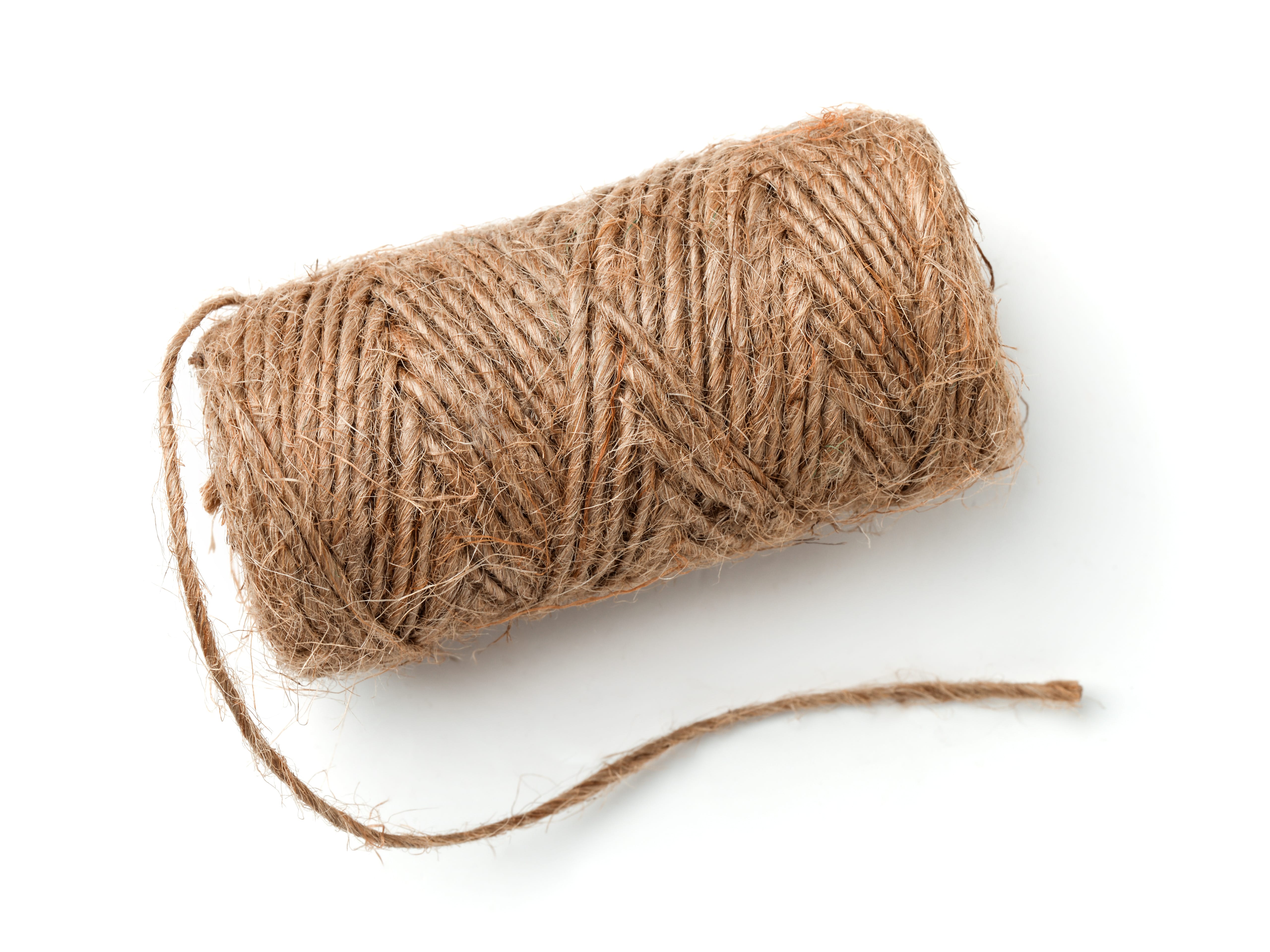 Top view of natural jute twine skein isolated on white