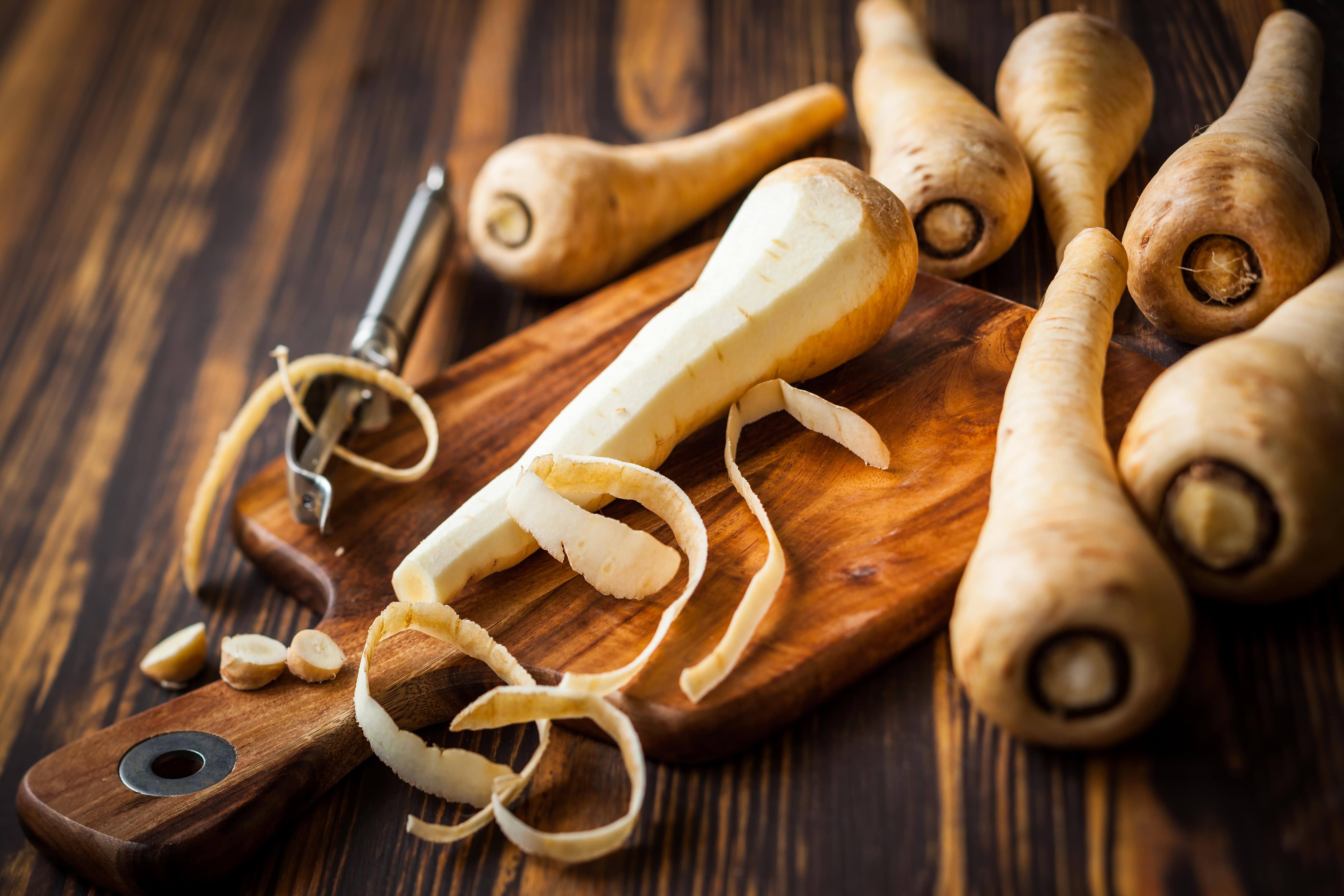 Fresh parsnip on wooden table