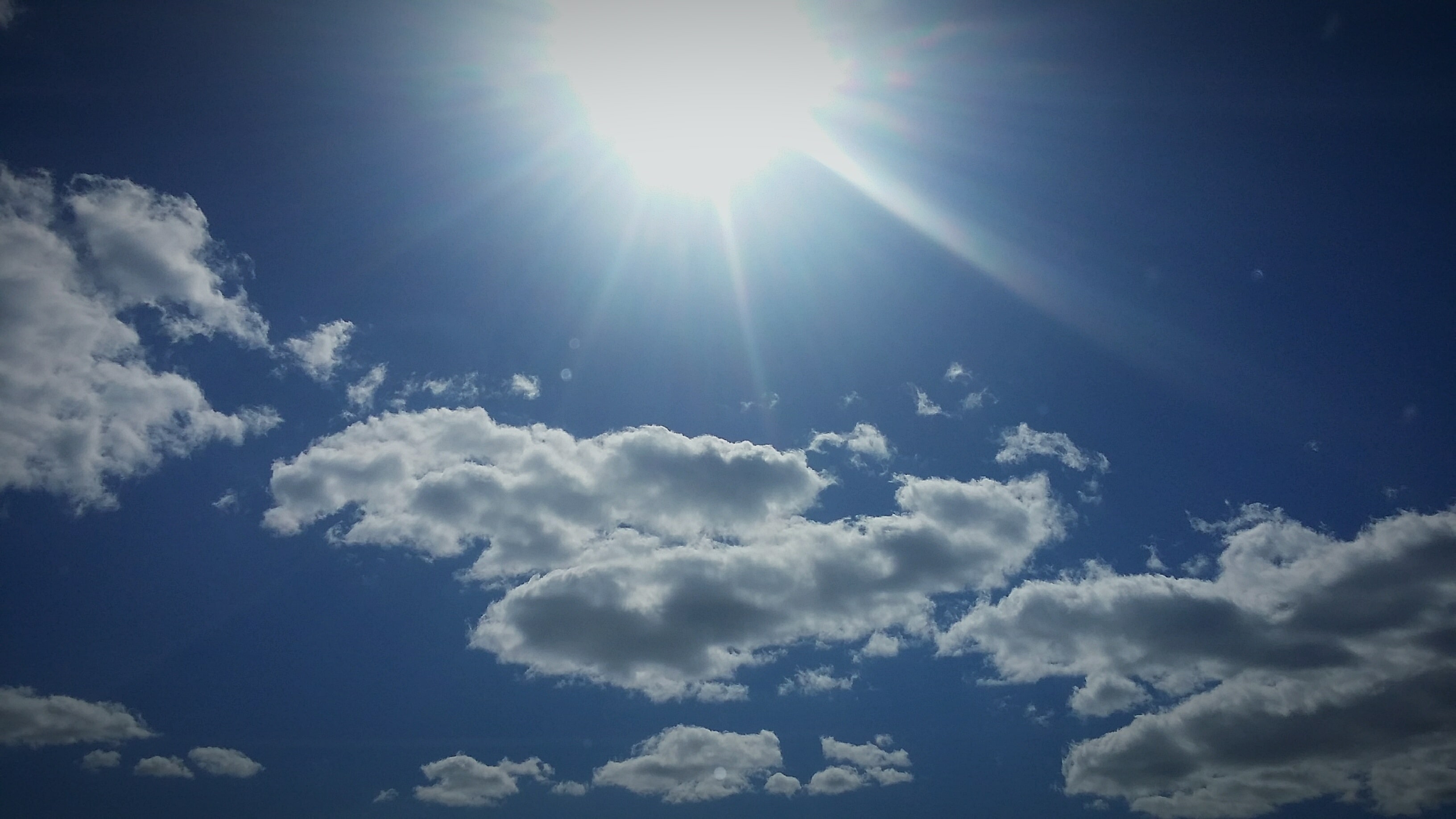 Low Angle View Of Bright Sunshine In Sky