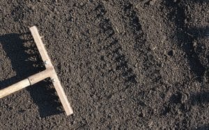 Image of rake in soil