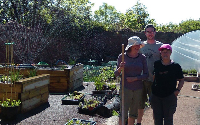 group of volunteers at the community garden centre