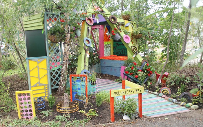 Volunteers way, seating area in community garden